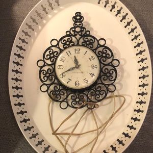 Vintage Black General Electric hard plastic plug-in wall clock.